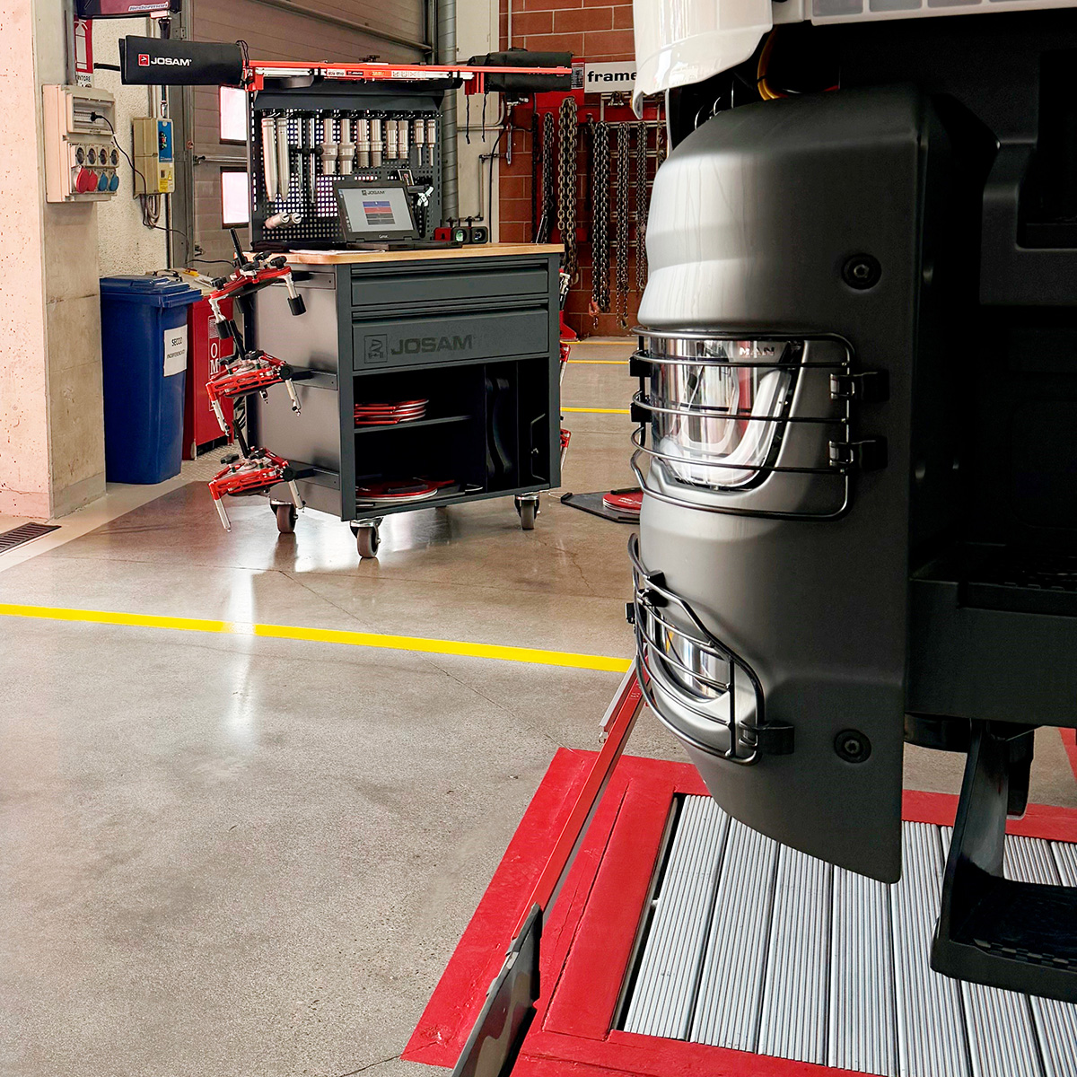JOSAM Cam-Aligner storage cabinet in the background a truck being aligned in the foreground