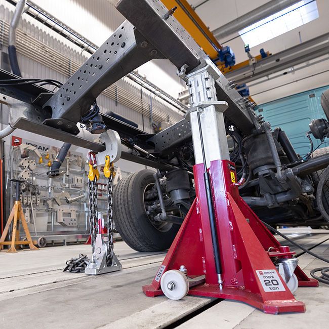 JOSAM jack being used on a truck frame