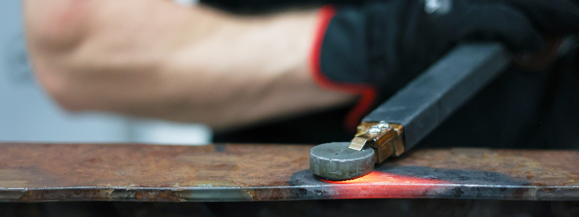 A technician using JOSAM JH1000 induction heater to heat metal surface