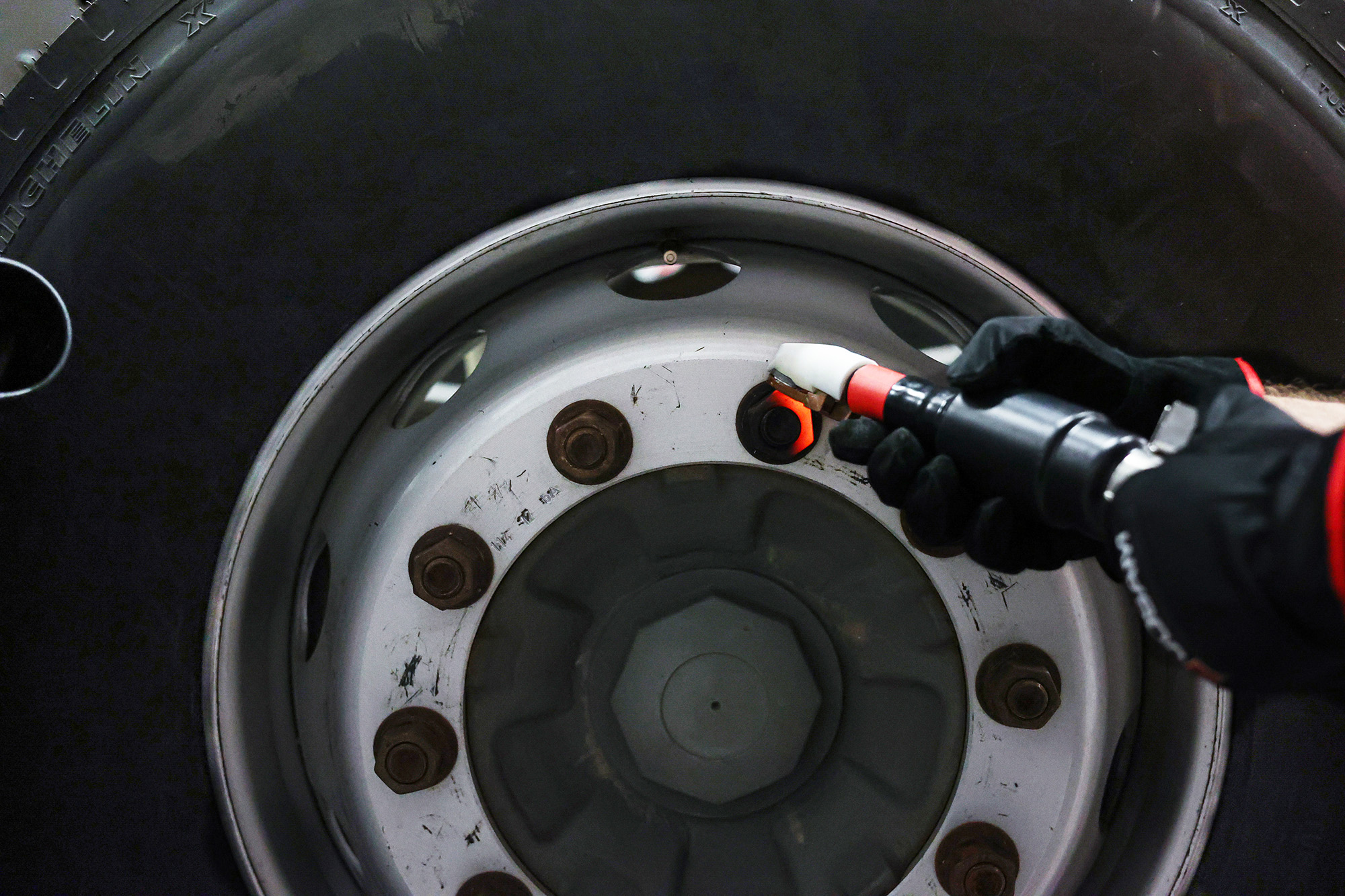 A technician using JOSAM JH400 induction heater to heat nut