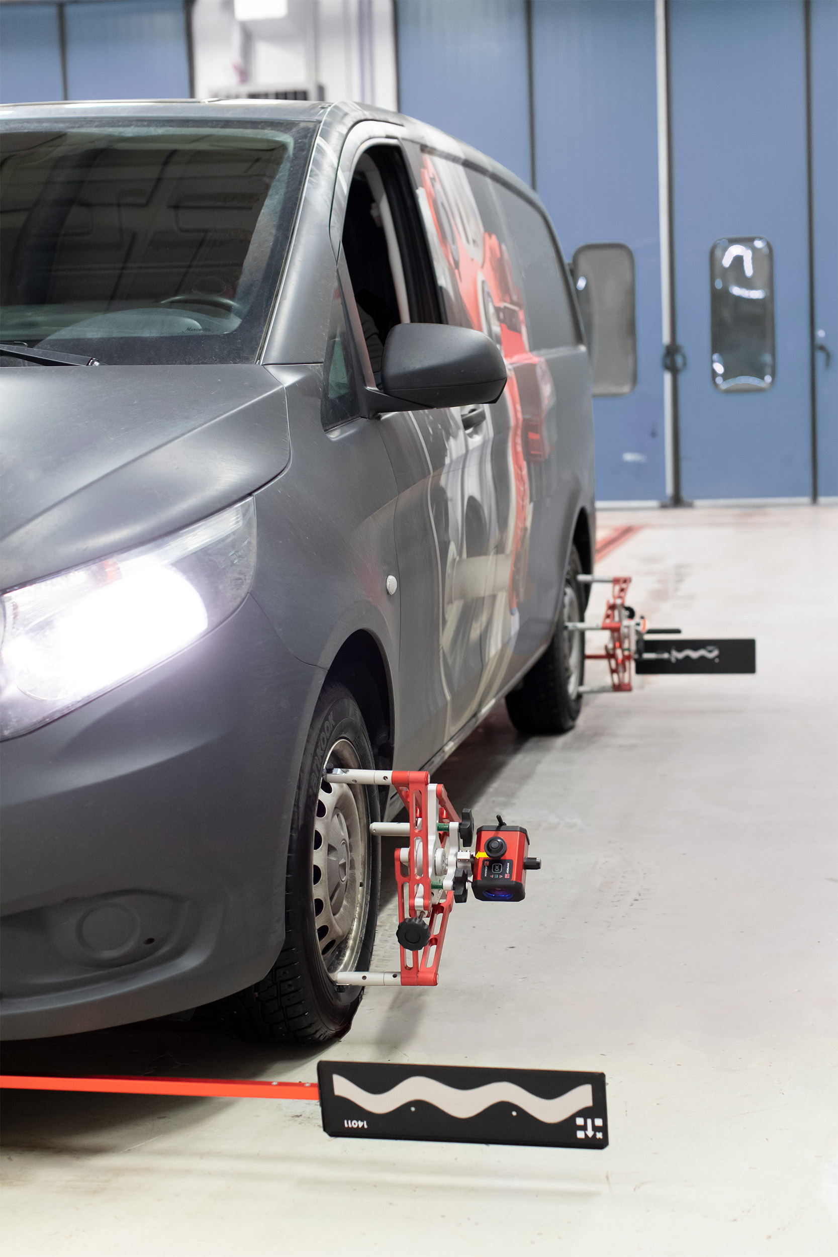 A van with Josam Cam-Aligners attached