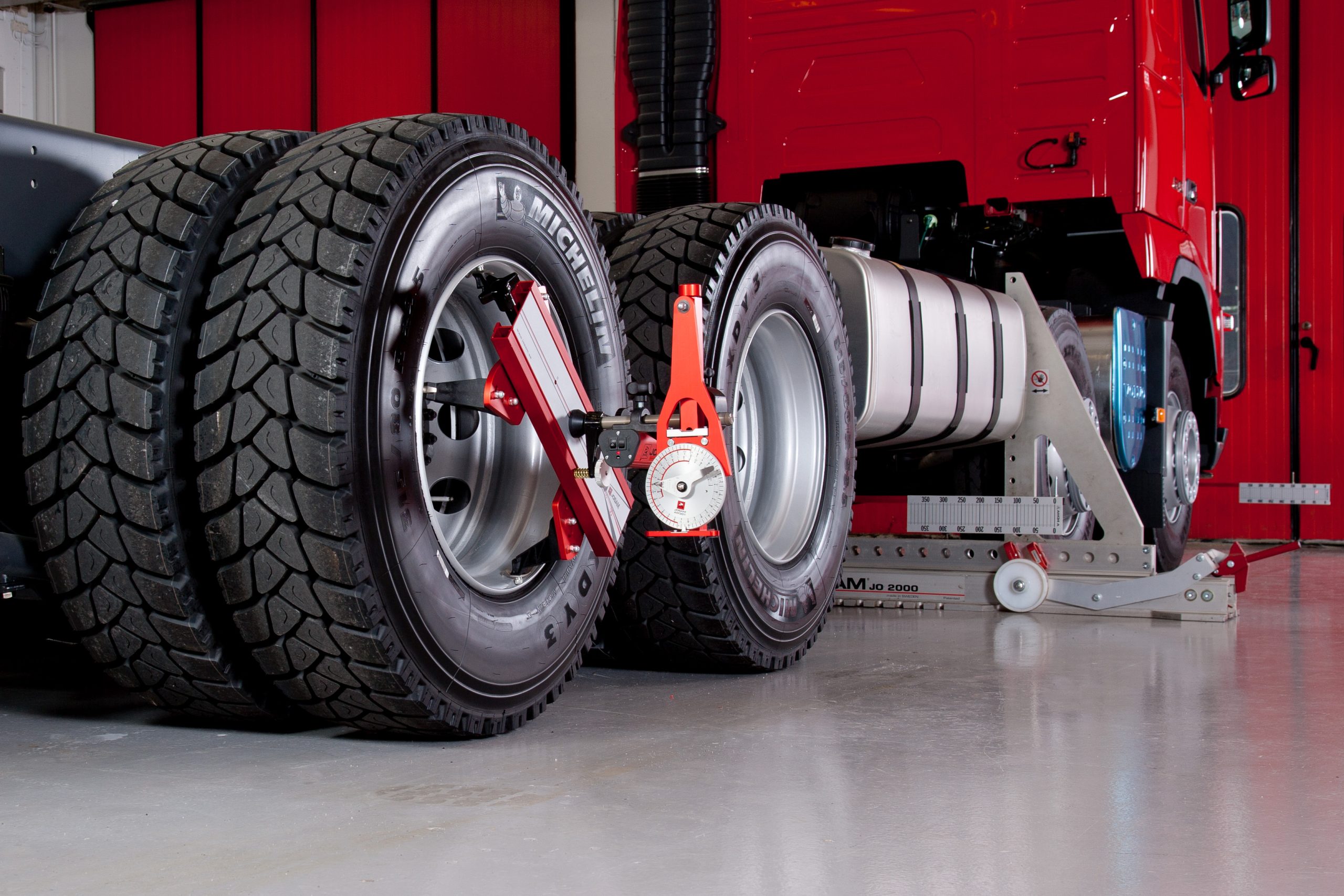A Truck with Josam Laser-AM wheel alignment system attached