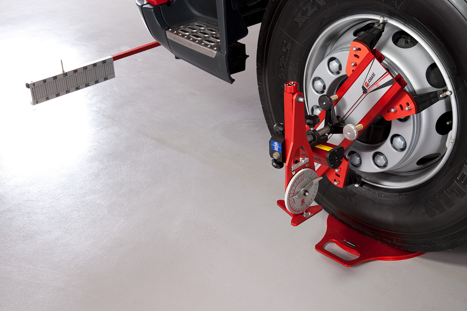 A wheel with Josam Laser-AM wheel alignment system attached