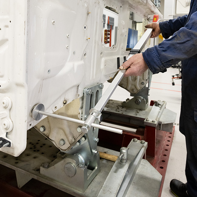 A technician using a measuring gauge