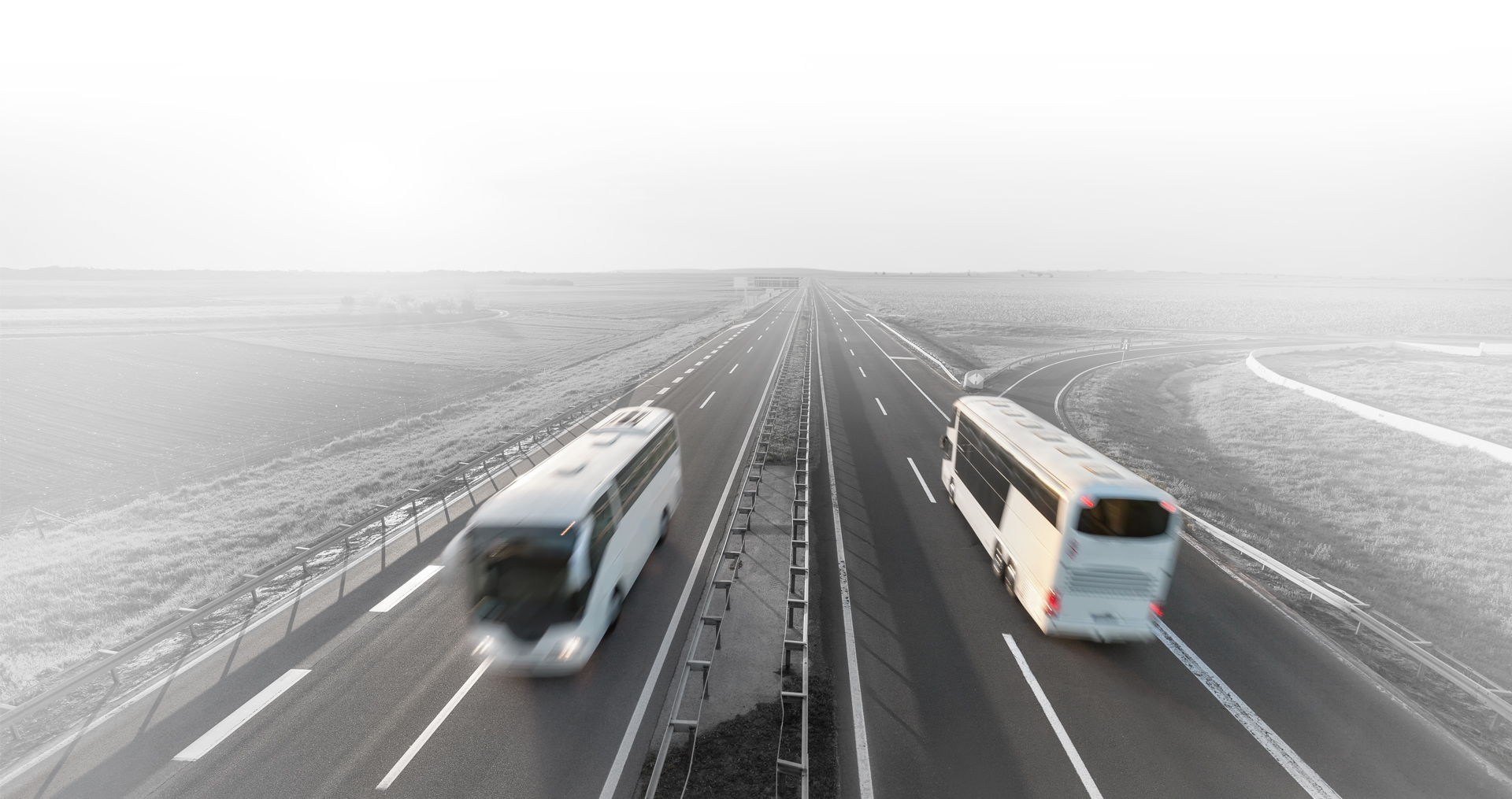 Buses passing in opposite directions on the motorway