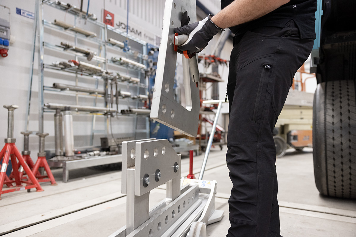 Technician assembling the parts of a JOSAM Frame Press trolley