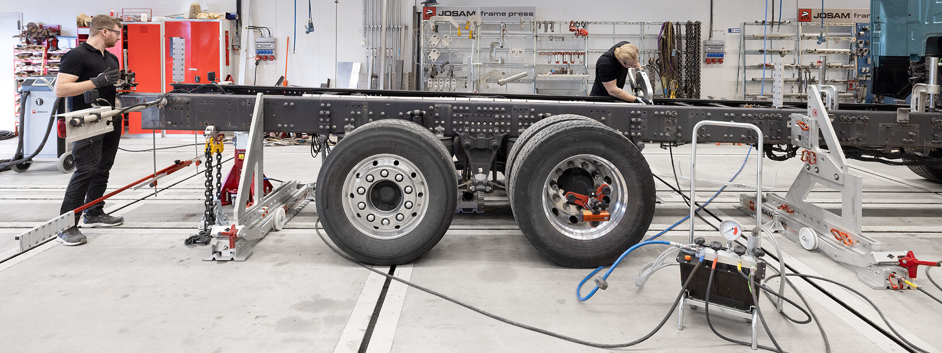 A JOSAM Frame Press system and wheel alignment system being utilized on a truck frame