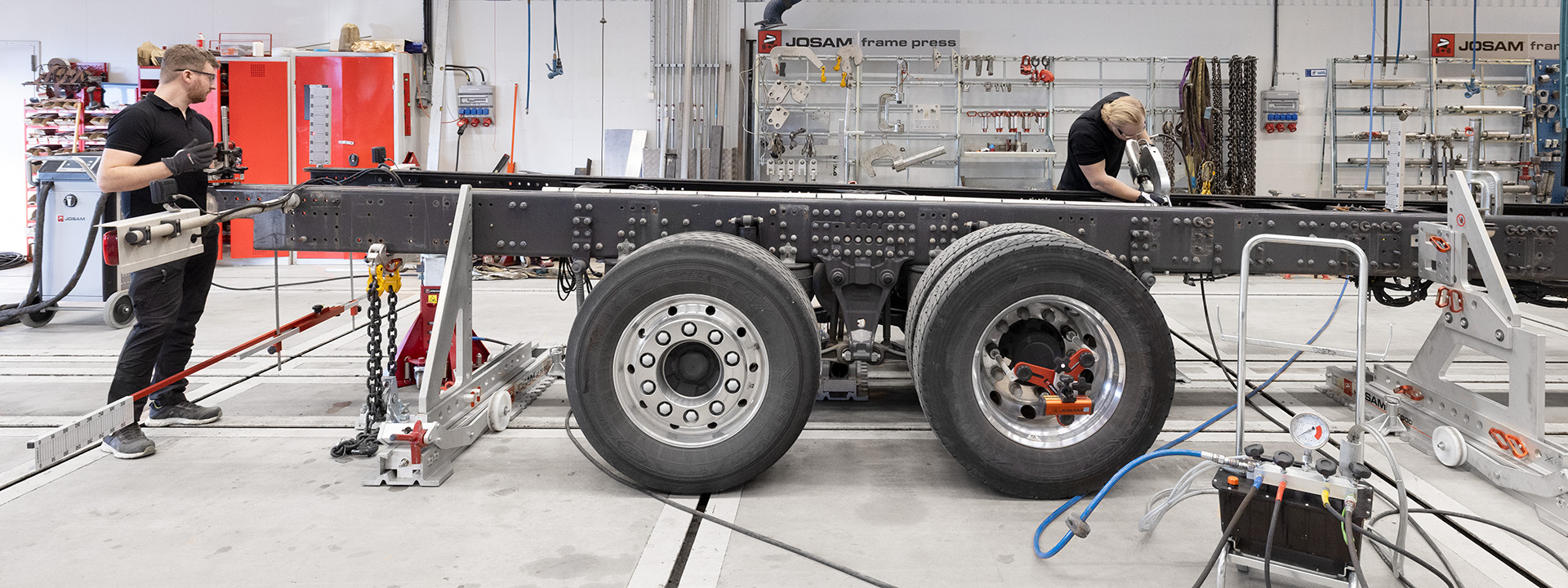 A JOSAM Frame Press system, wheel alignment system and induction heater being utilized on a truck frame