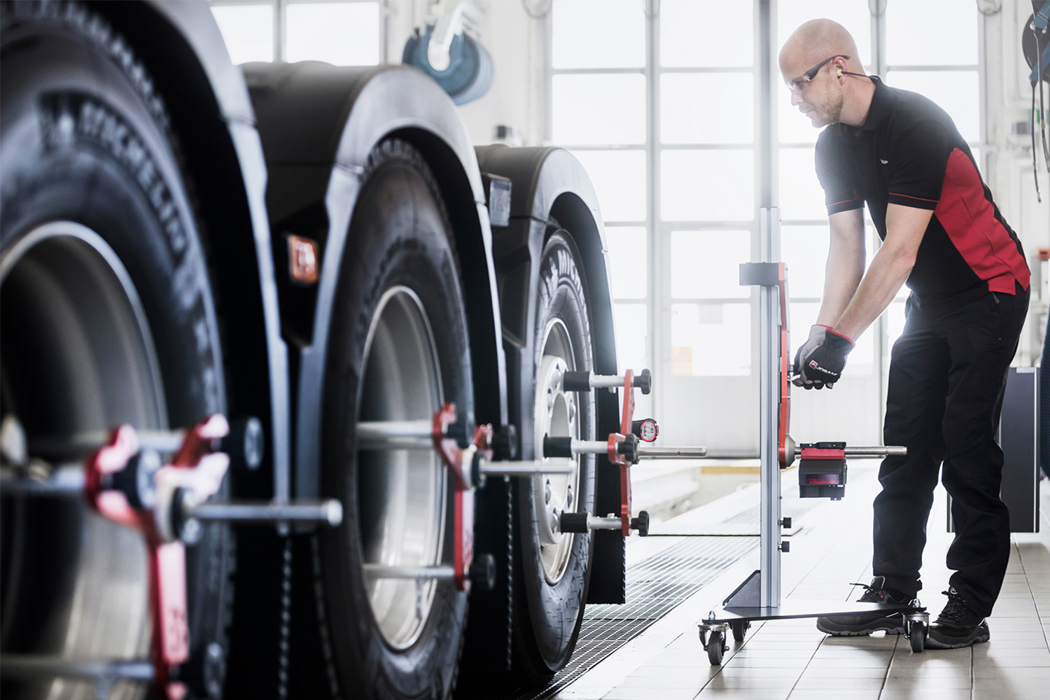 Technician affixing I-Track II to vehichle