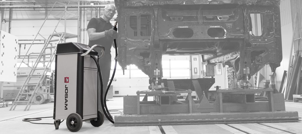 Technician using a JOSAM JH400 induction heater in a workshop