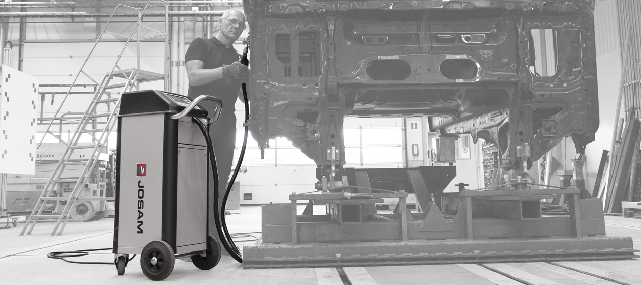 Technician using a JOSAM JH400 induction heater in a workshop