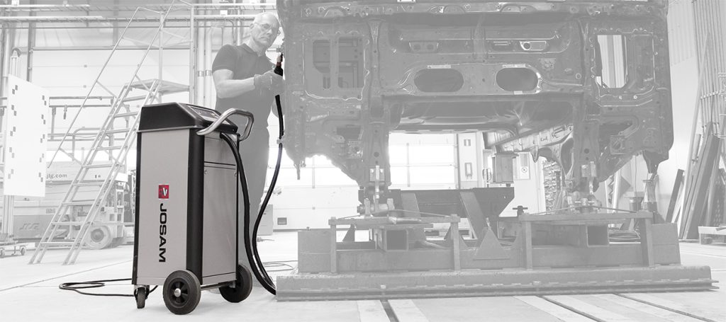Technician using a JOSAM JH400 induction heater in a workshop