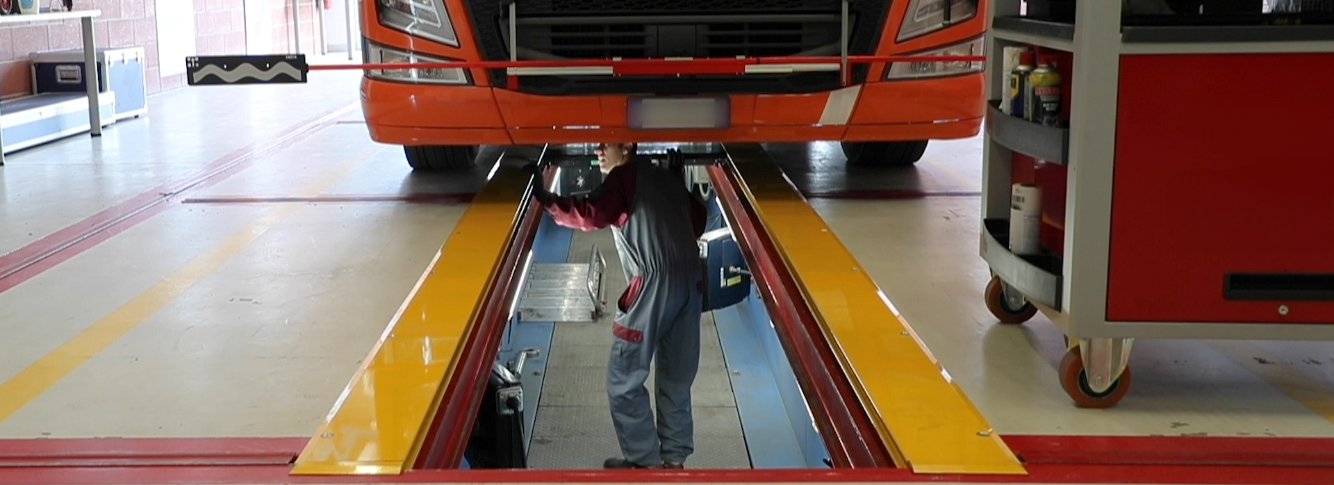 Technician working in a floor pit