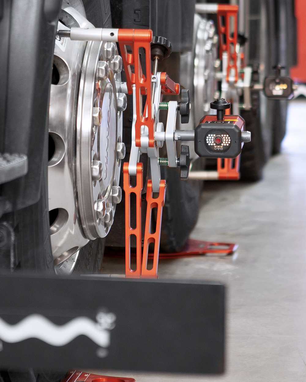 JOSAM Cam-Aligner being used in wheel alignment