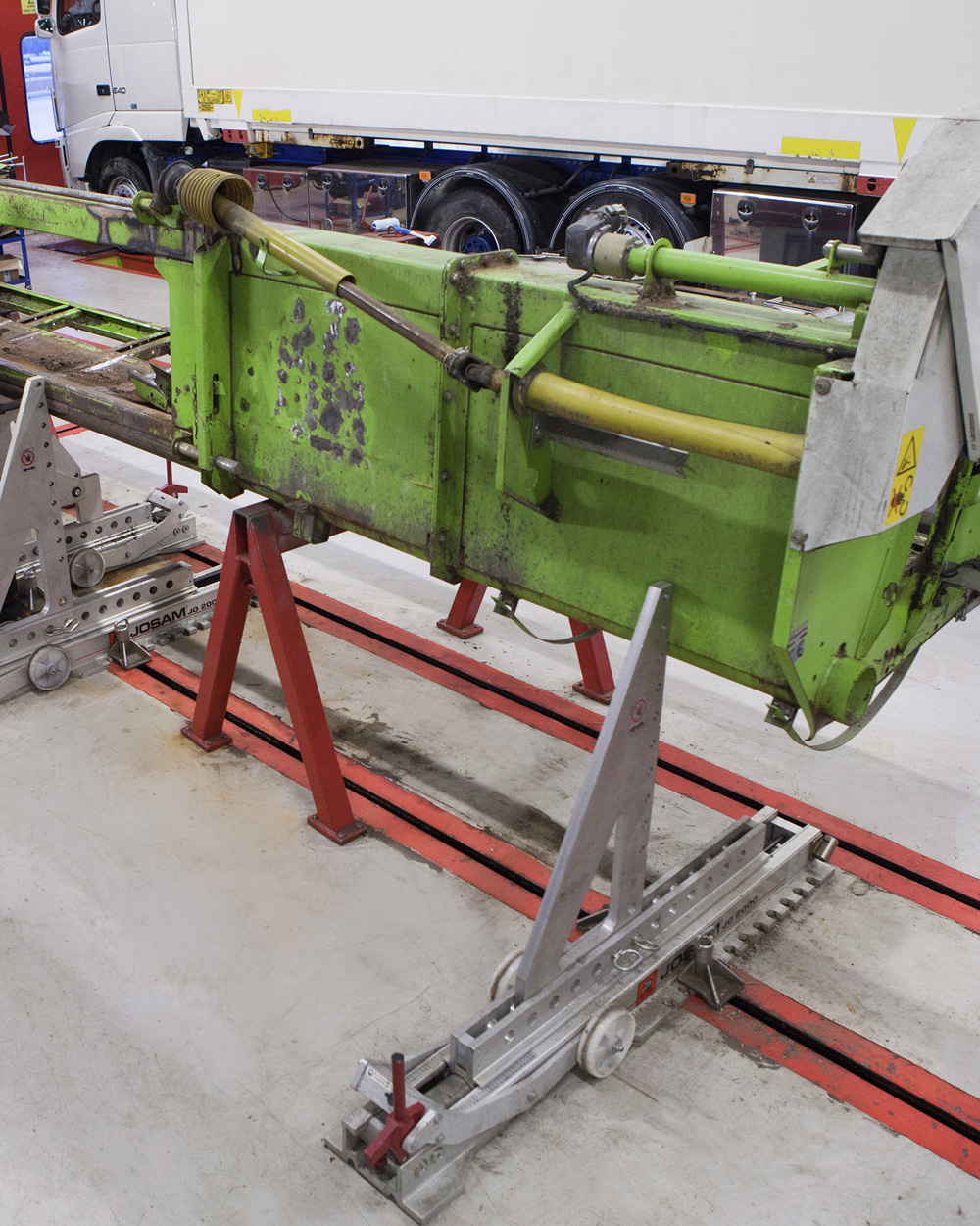 A large piece of equipment being straightened in the JOSAM workshop